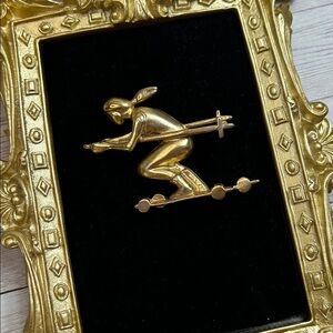 Vintage gold-tone designer-signed Elle skier brooch